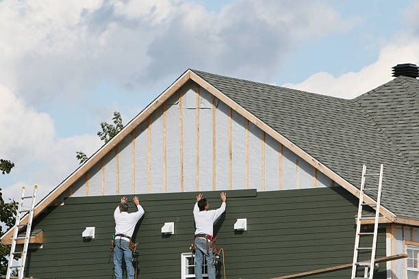 Professional Siding technician working in Floral Park, NY
